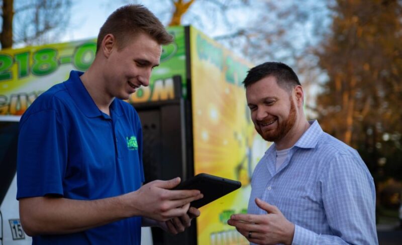 Folsom junk removal professional interacting with a customer